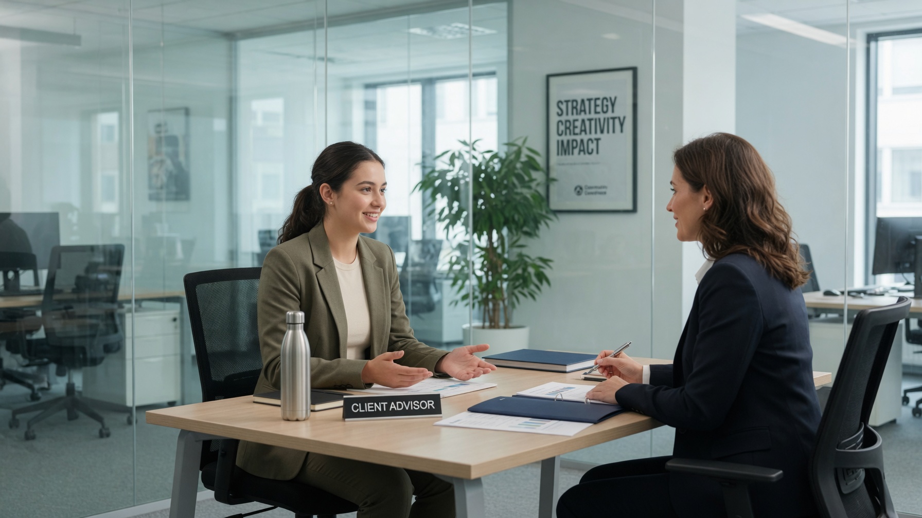 A prospective model meeting with an agency representative in a professional office setting.